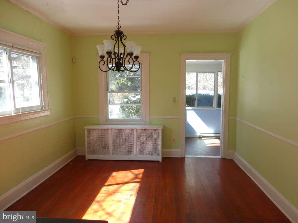 2435 Everton Road Baltimore, MD 21209 - Photo 8 of 28 a room with wooden floor and windows