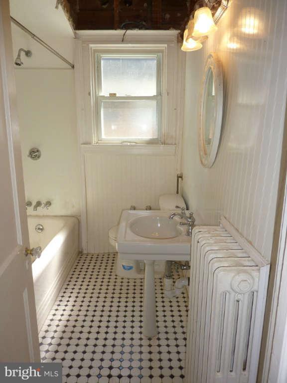 2435 Everton Road Baltimore, MD 21209 - Photo 9 of 28 a bathroom with a sink a toilet and shower