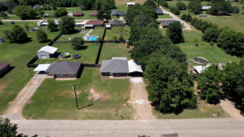 1974 County Road Powderly, TX 75473 - Photo 27 of 28 an aerial view of residential houses with outdoor space
