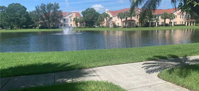 a view of a lake with a building in the background