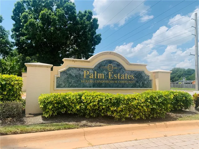 a view of sign board with flower around