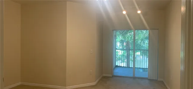 a view of an empty room and window