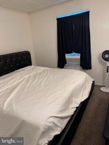 a bedroom with a bed and cabinets