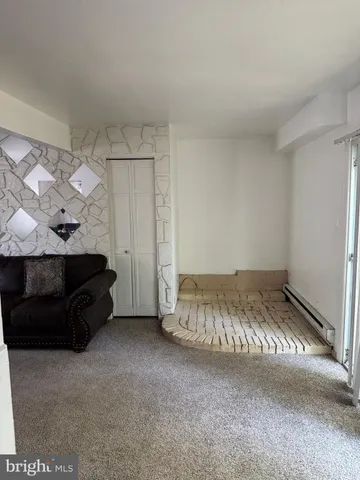 a bedroom with bed and a cabinets