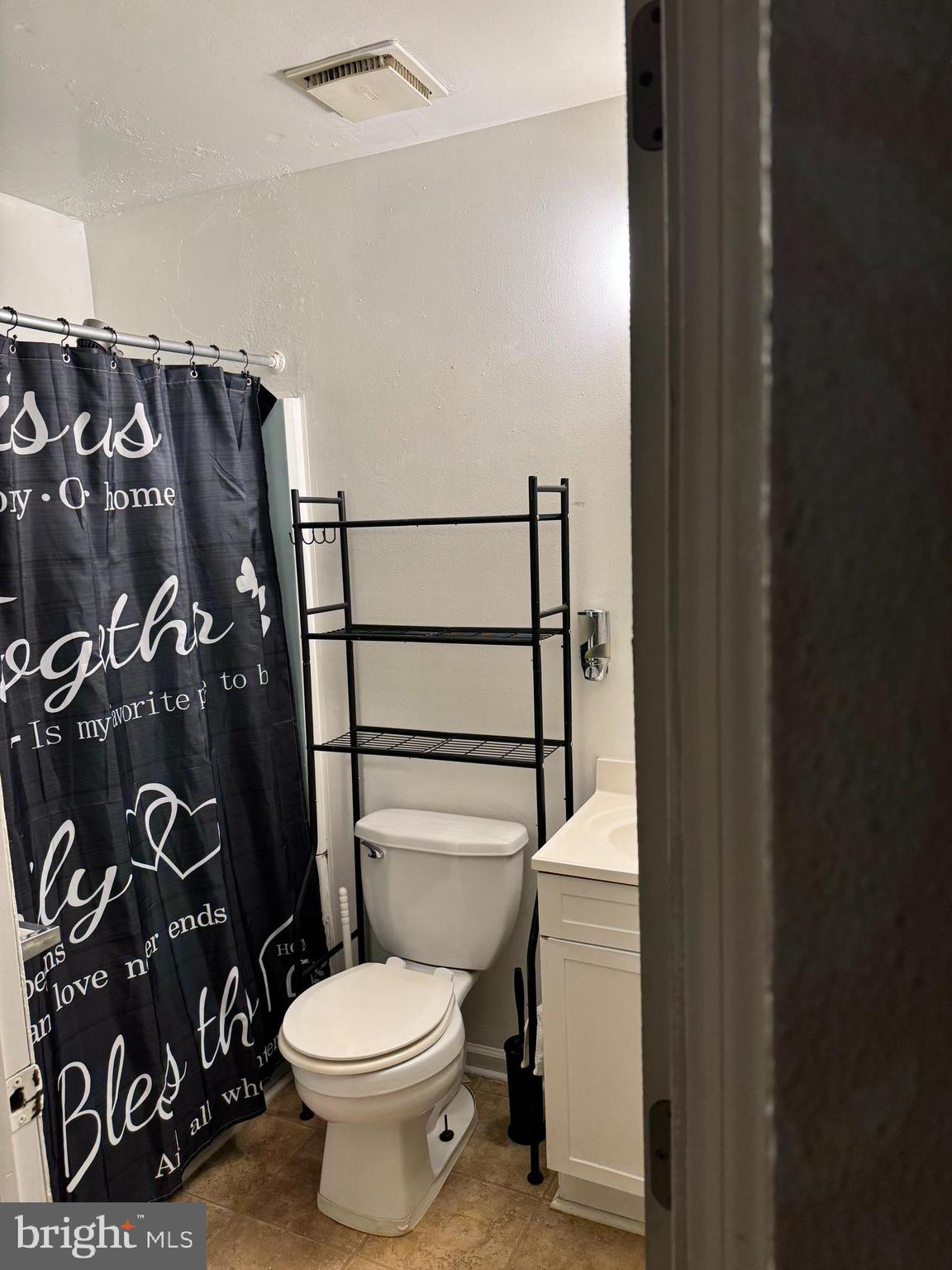 36 Edinshire Road Sicklerville, NJ 08081 - Photo 10 of 21 a bathroom with a toilet and a shower curtain