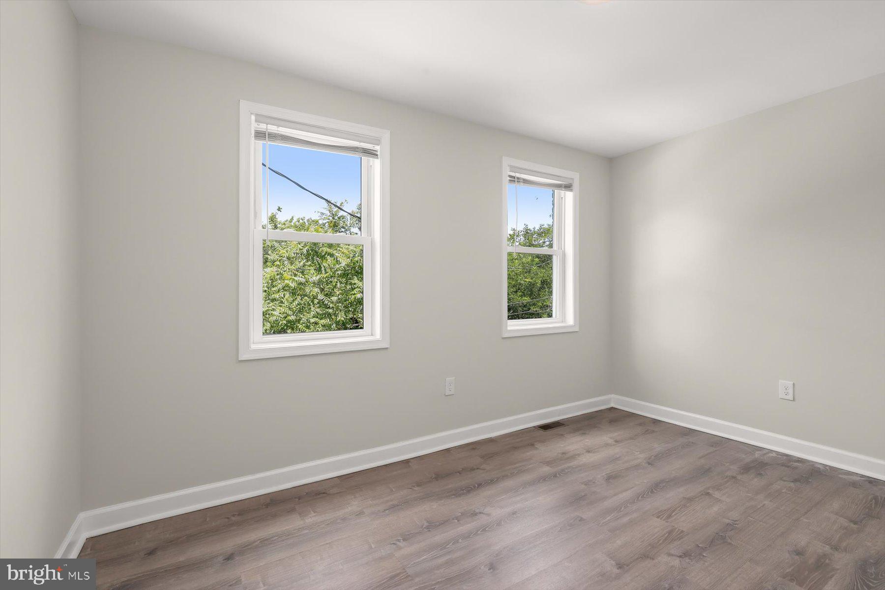 1044 Ellicott Driveway Baltimore, MD 21216 - Photo 11 of 26 an empty room with a window