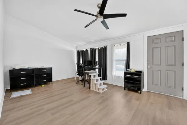 a room with furniture and wooden floor