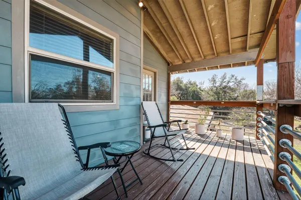 a view of a chairs on the deck