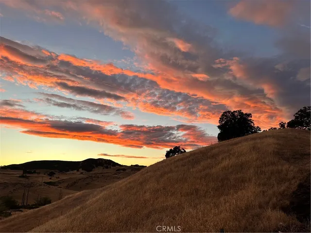 a view of house with mountains in the background