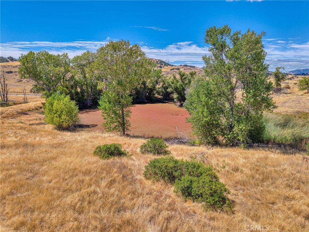 4378 Hill Road Lakeport, CA 95453 - Photo 24 of 38 an aerial view of a house with a yard and mountain view in back