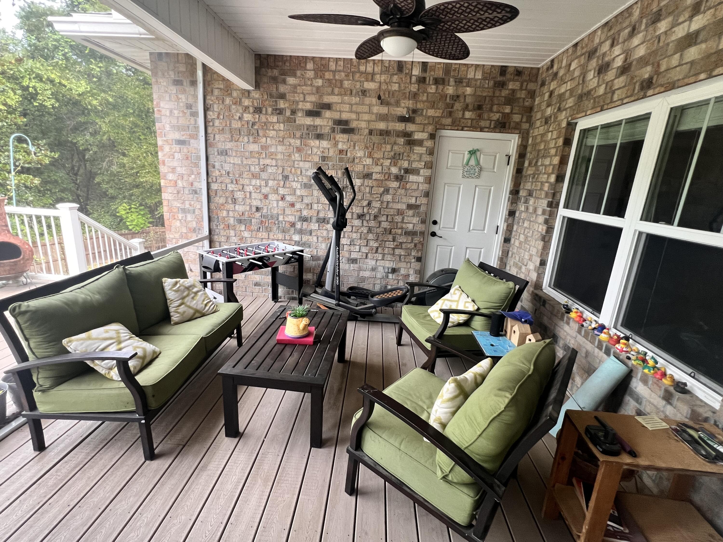 4078 Bond Circle Niceville, FL 32578 - Photo 29 of 37 a living room with furniture and a flat screen tv