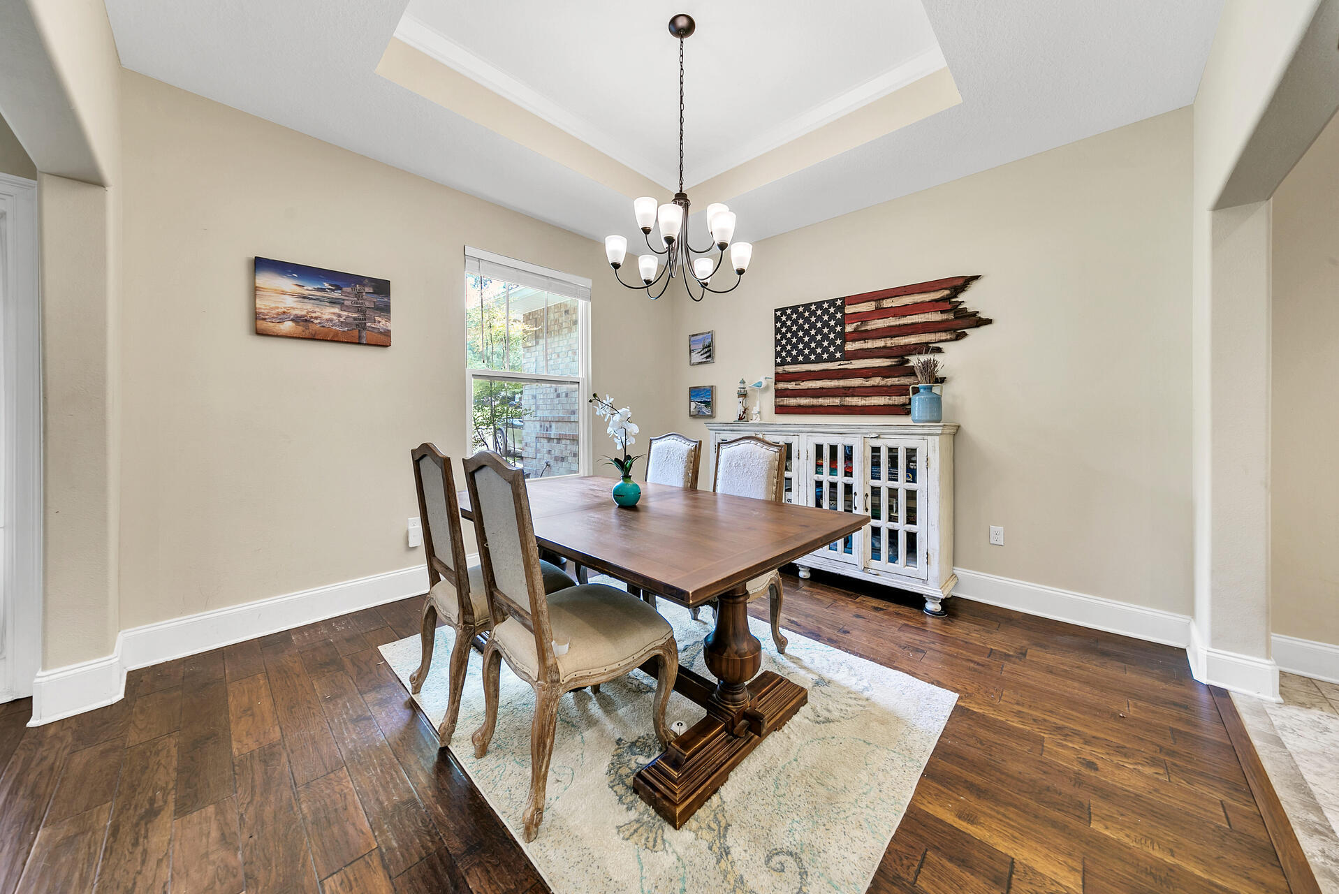 4078 Bond Circle Niceville, FL 32578 - Photo 6 of 37 a view of a dining room with furniture a chandelier and wooden floor