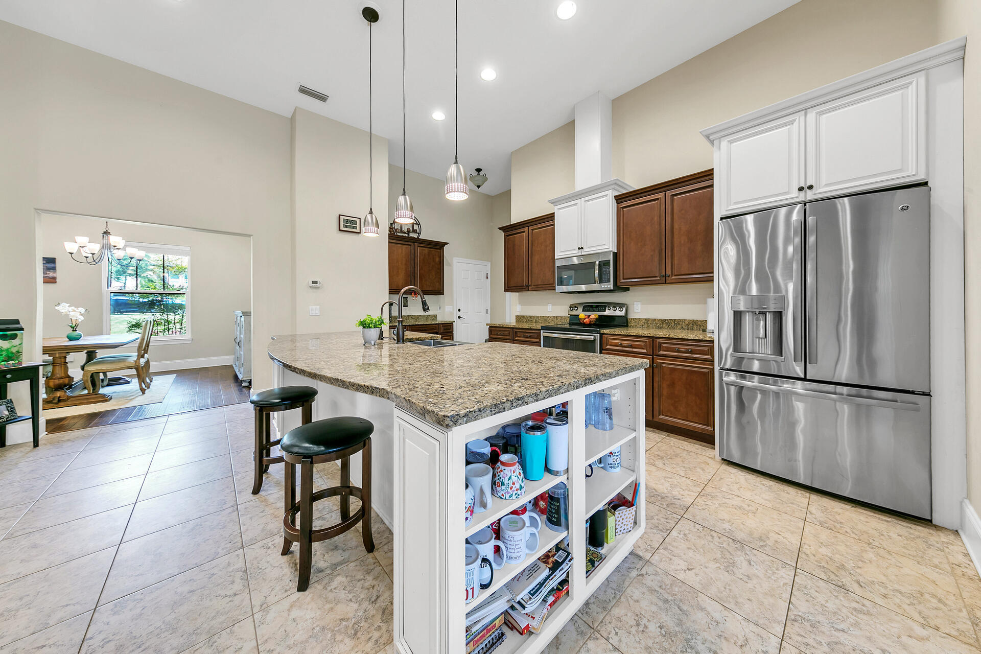 4078 Bond Circle Niceville, FL 32578 - Photo 10 of 37 a kitchen with stainless steel appliances a stove a sink a refrigerator and a refrigerator