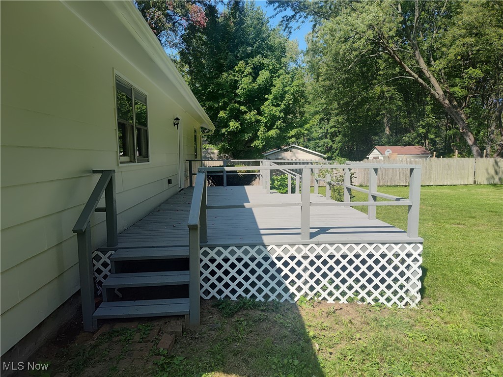 8016 Ninevah Road Geneva, OH 44041 - Photo 10 of 45 Wooden deck featuring view of scattered trees
