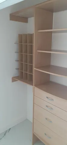 a kitchen with granite countertop white cabinets and black appliances
