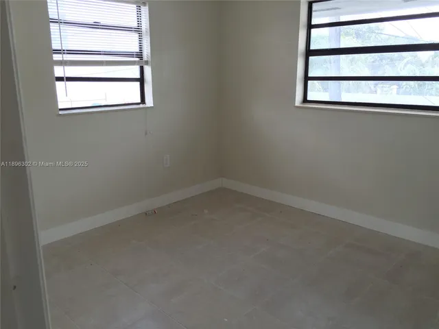 a bathroom with a toilet and bathtub