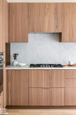 a view of a kitchen with wooden floor