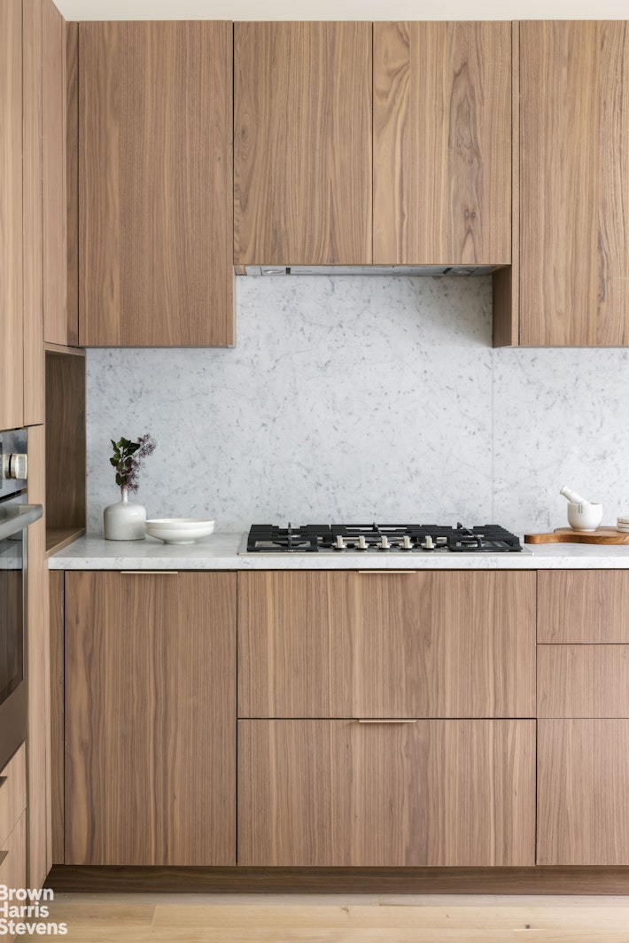 353 20th Street Brooklyn, NY 11215 - Photo 3 of 17 a view of a kitchen with wooden floor