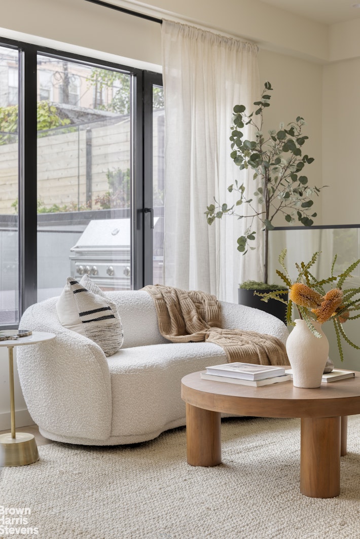 353 20th Street Brooklyn, NY 11215 - Photo 4 of 17 a living room with furniture and a large window