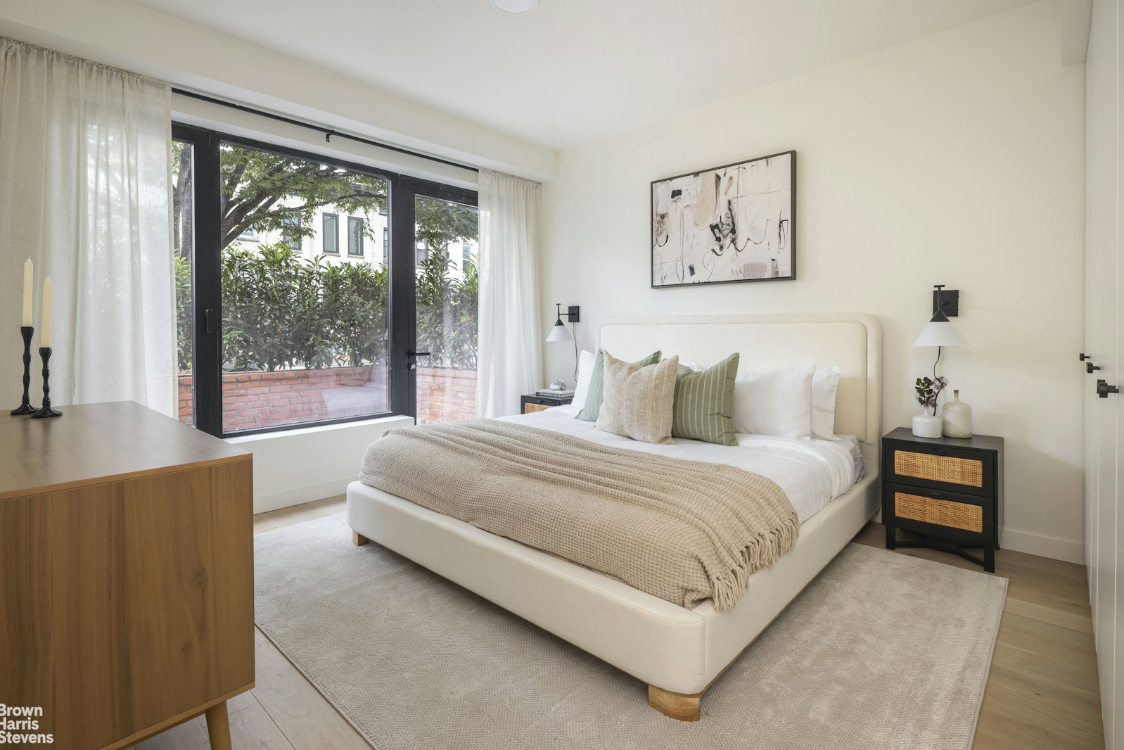 353 20th Street Brooklyn, NY 11215 - Photo 6 of 17 a bedroom with a large bed and a large window