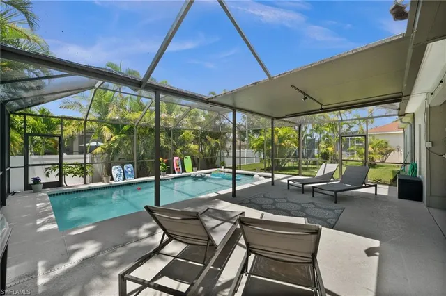 a dining room with furniture water view and a large window