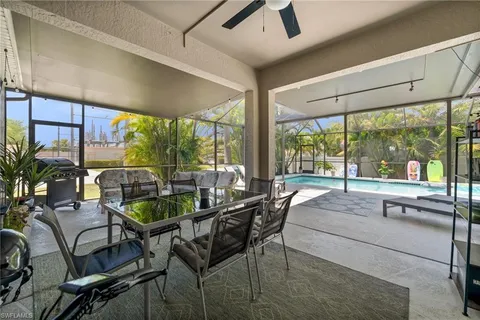 a living room with lots of furniture and kitchen view
