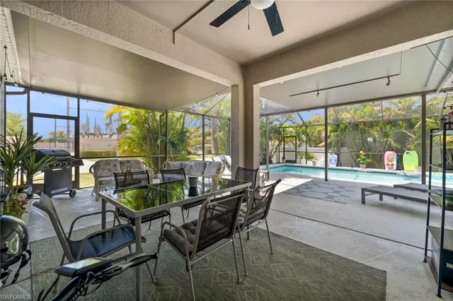 a living room with lots of furniture and kitchen view