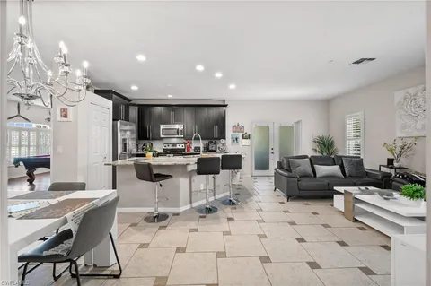 a living room with furniture and a clock