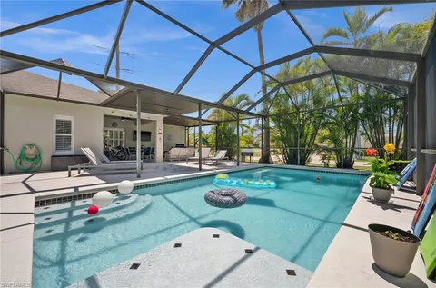 a room with patio outer view and outdoor seating