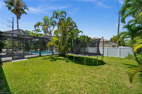 a view of a backyard with a patio and plants