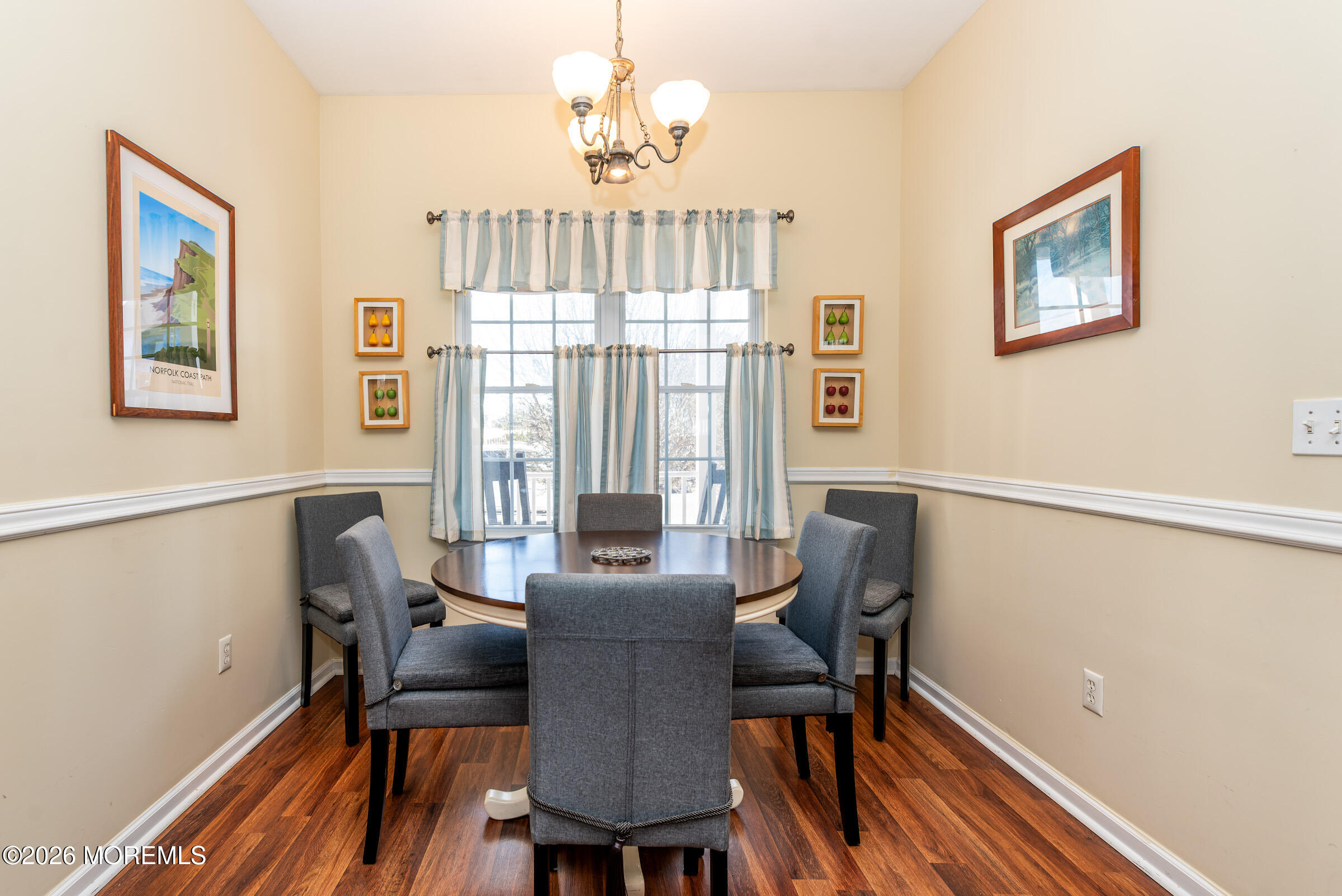 1609 Tamiami Road Forked River, NJ 08731 - Photo 20 of 49 a view of a dining room with furniture window and wooden floor