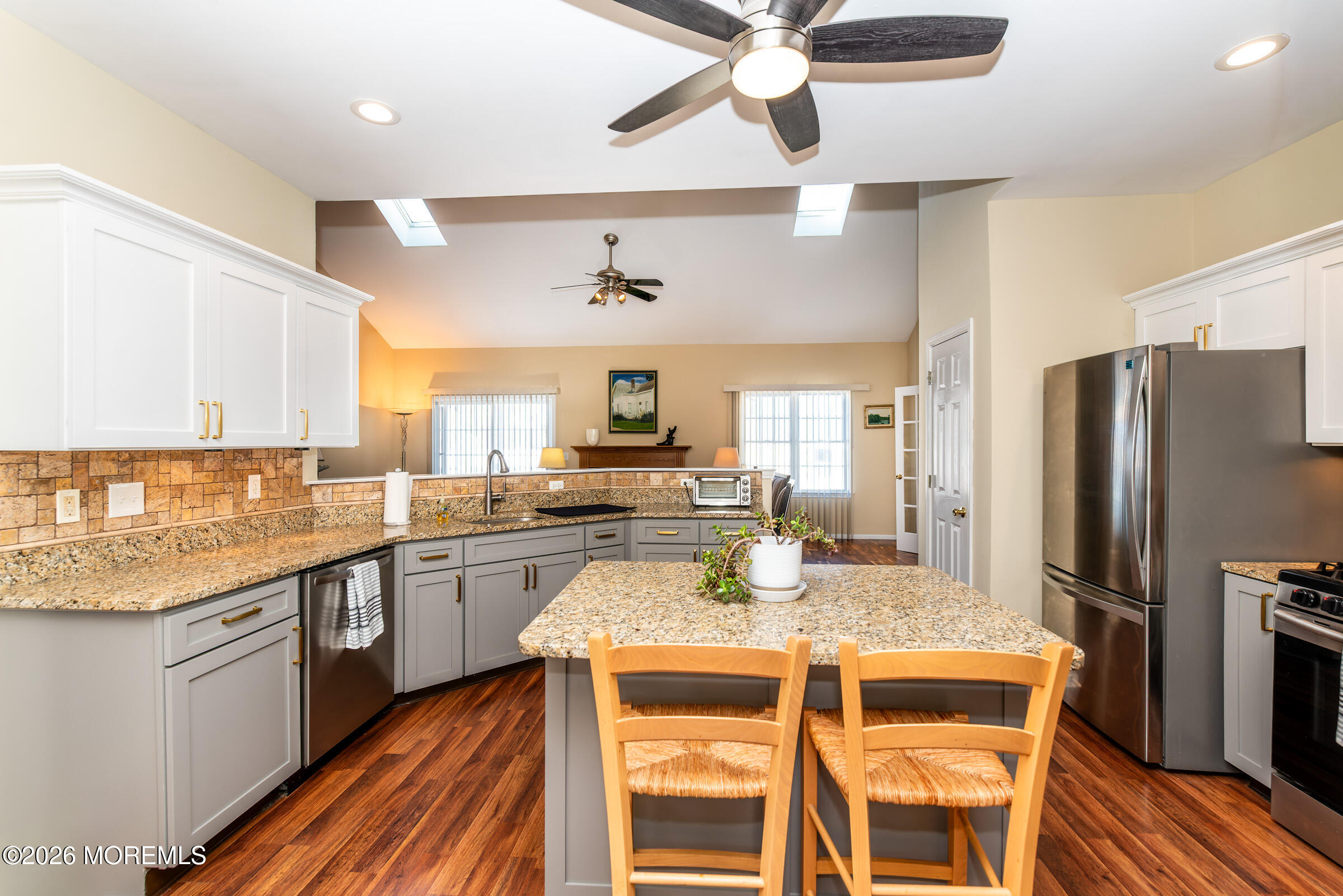 1609 Tamiami Road Forked River, NJ 08731 - Photo 21 of 49 a kitchen with granite countertop stainless steel appliances a sink and cabinets