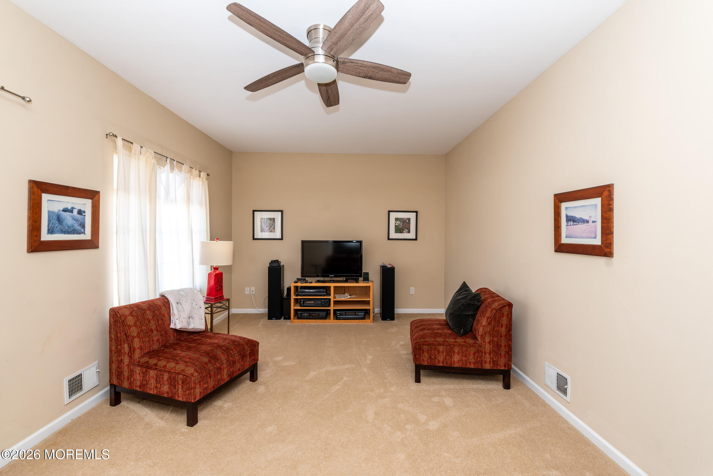 1609 Tamiami Road Forked River, NJ 08731 - Photo 25 of 49 a living room with furniture and a flat screen tv
