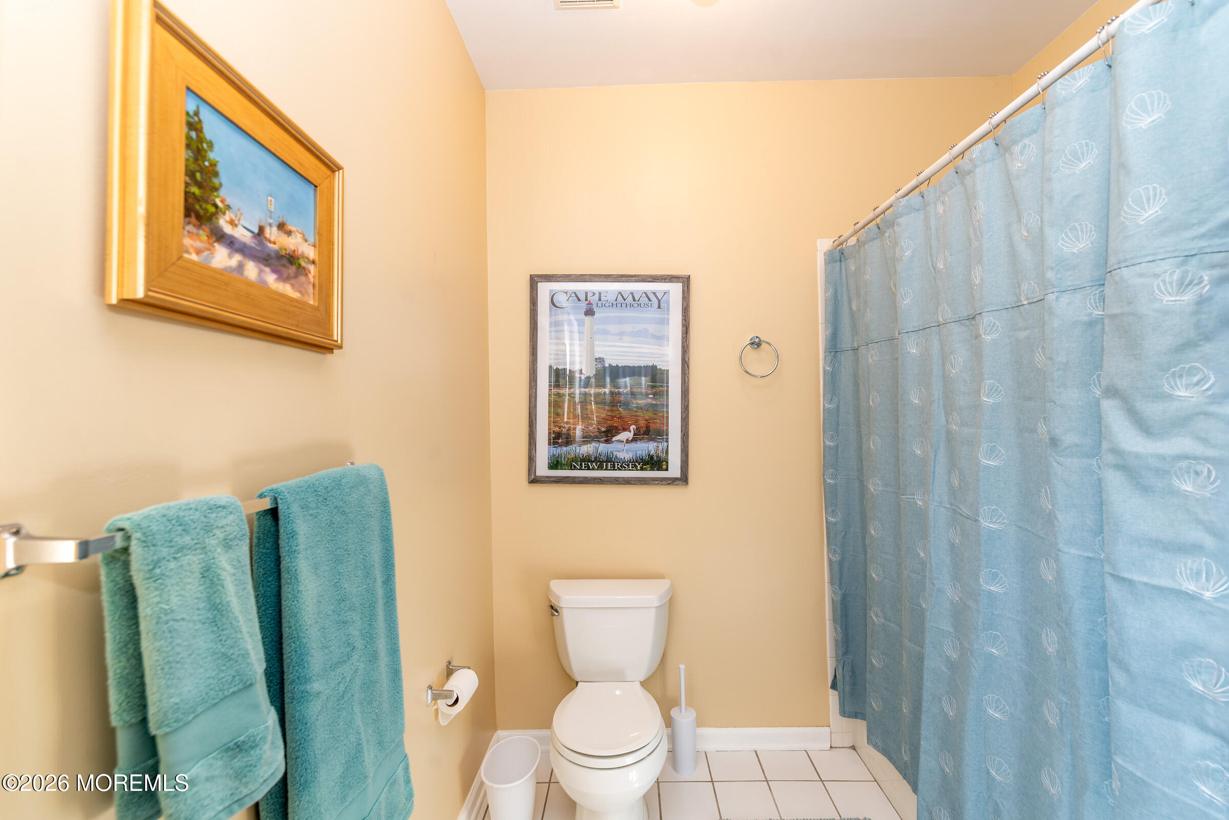 1609 Tamiami Road Forked River, NJ 08731 - Photo 31 of 49 a bathroom with a toilet and a shower curtain