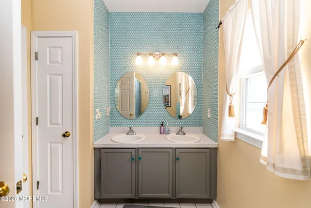 a living room with furniture a ceiling fan and a window
