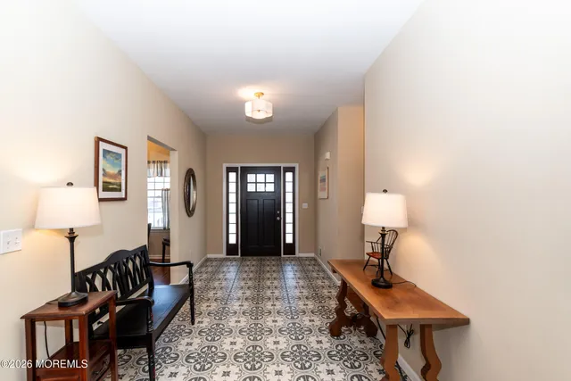 a view of a livingroom with furniture and a carpet