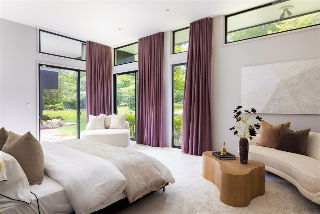 50 Crestwood Road Newton, MA 02465 - Photo 11 of 18 a bedroom with a large bed and a potted plant