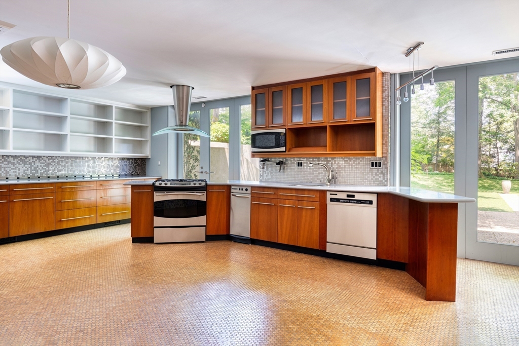 50 Crestwood Road Newton, MA 02465 - Photo 16 of 18 a kitchen with stainless steel appliances a stove and a refrigerator