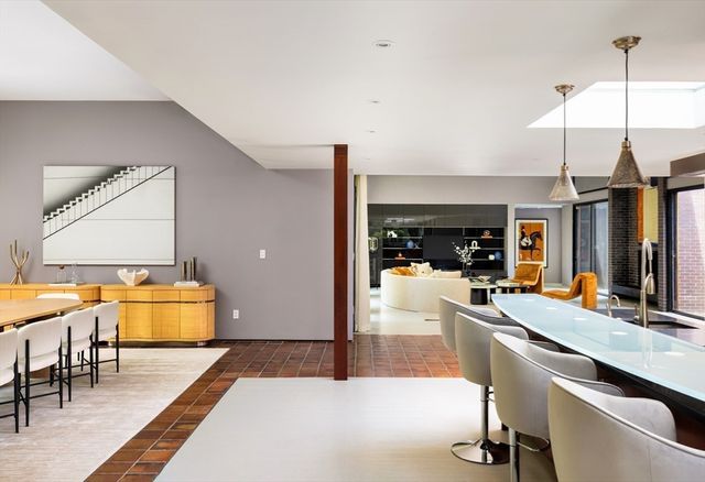 a kitchen with a sink and a stove top oven
