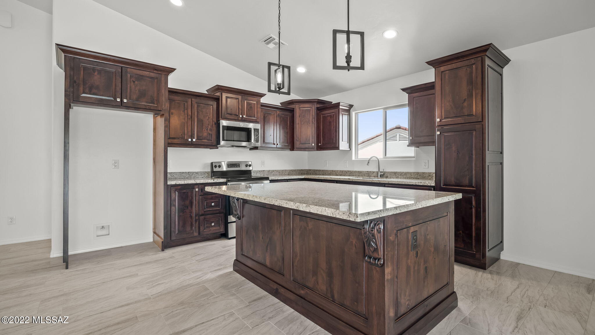 393 Quail Court Rio Rico, AZ 85648 - Photo 6 of 21 a kitchen with stainless steel appliances granite countertop a stove a refrigerator a sink dishwasher and a cabinets with wooden floor