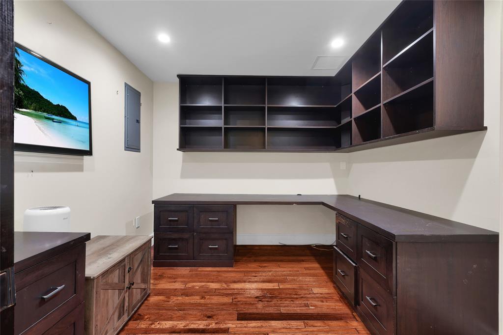 14701 Southwest 63rd Street Southwest Ranches, FL 33330 - Photo 14 of 64 a kitchen with stainless steel appliances cabinets and wooden floor