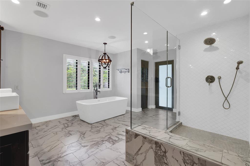14701 Southwest 63rd Street Southwest Ranches, FL 33330 - Photo 17 of 64 a bathroom with a granite countertop sink a mirror and shower
