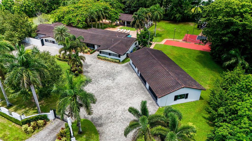 14701 Southwest 63rd Street Southwest Ranches, FL 33330 - Photo 2 of 64 an aerial view of a house with garden space and street view