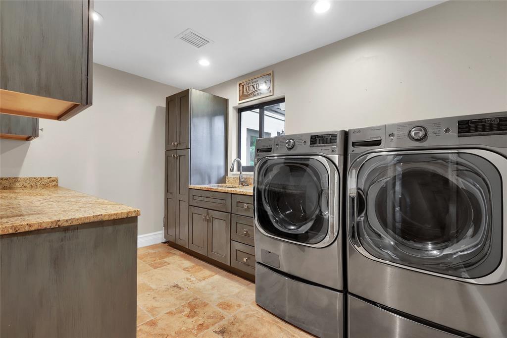 14701 Southwest 63rd Street Southwest Ranches, FL 33330 - Photo 33 of 64 a utility room with sink dryer and washer