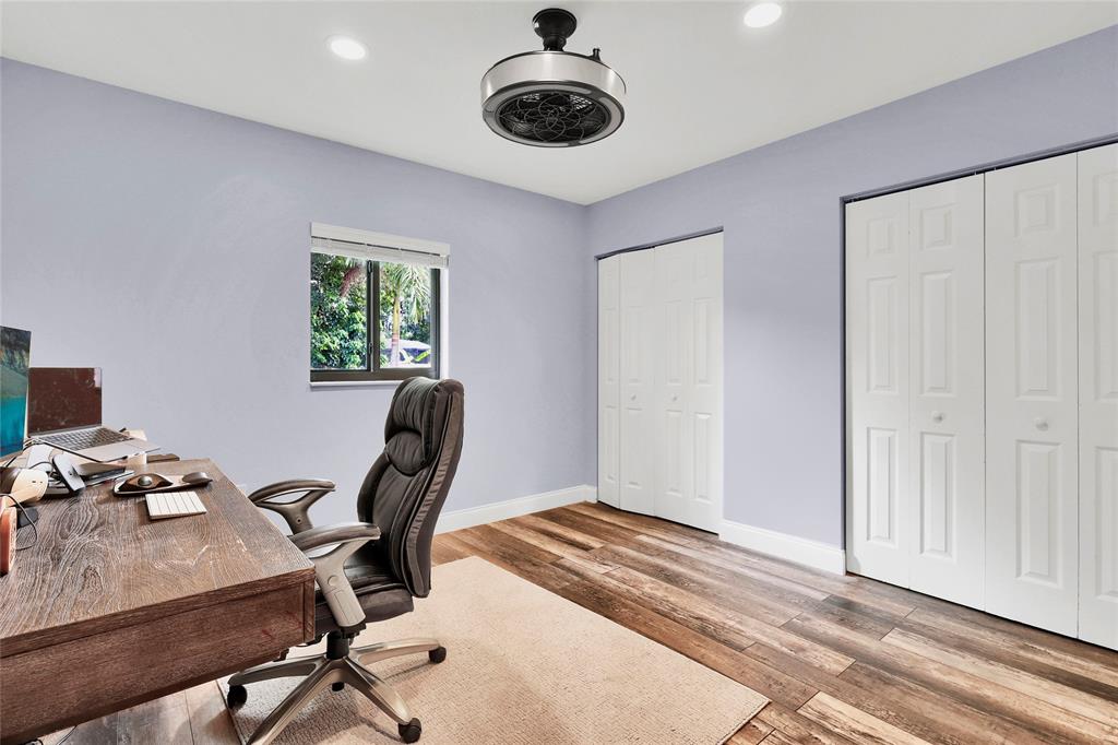 14701 Southwest 63rd Street Southwest Ranches, FL 33330 - Photo 48 of 64 a view of a workspace with furniture and a window