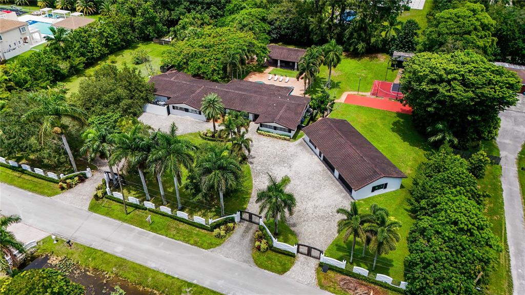 14701 Southwest 63rd Street Southwest Ranches, FL 33330 - Photo 54 of 64 an aerial view of a house with a garden