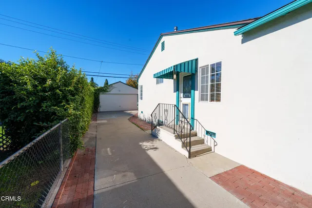 a view of a house with a small yard