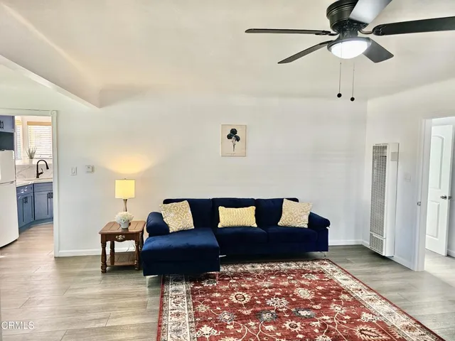 a living room with furniture and a rug