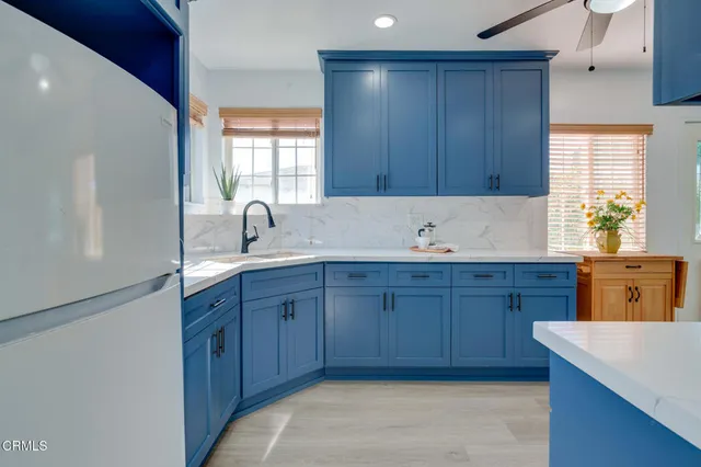 a kitchen with stainless steel appliances granite countertop wooden cabinets a sink and dishwasher