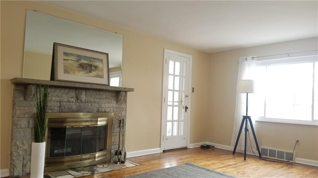 491 Old Farm Road Pittsburgh, PA 15228 - Photo 15 of 23 Living room with beautiful stone fireplace and granite hearth